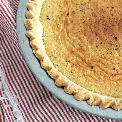 Brown Butter Buttermilk Pie - A classic buttermilk pie with the flavor of browned butter added in. Get this delicious dessert recipe from CookingWithBooks.com