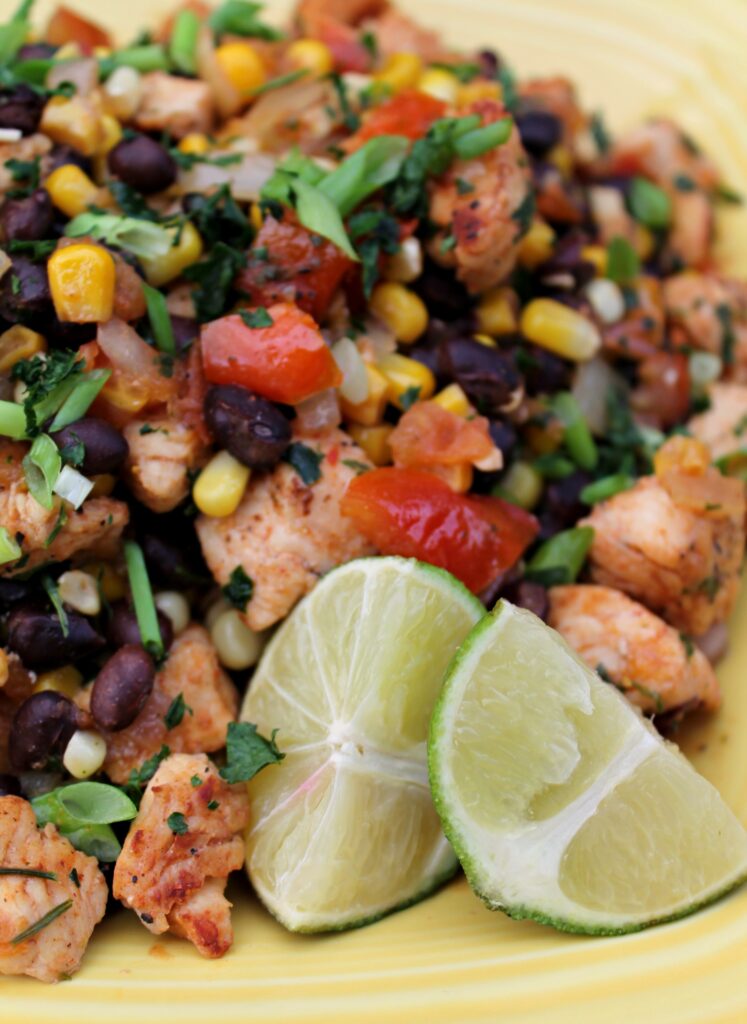 This colorful Southwestern chicken dinner recipe is packed with corn, black beans, fresh cilantro, tomatoes, and lime, it's bound to become a favorite, no matter what season!