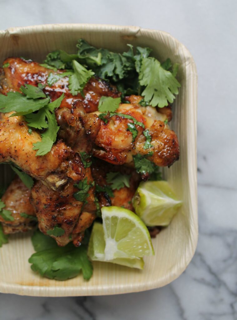 Honey Glazed Cilantro Lime Wings - The perfect game day appetizer! Get the recipe from CookingWithBooks.net